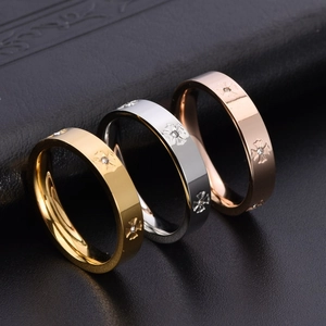 Set of three 18K gold plated titanium steel rings with cross star patterns and small zircon