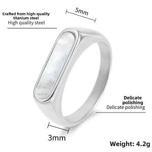Detailed view of polished steel ring featuring a white shell inlay and 5mm width