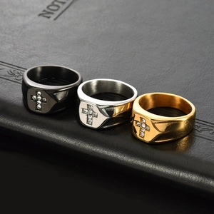 Three men's stainless steel cross rings in black, silver, and gold with micro zircon inlay