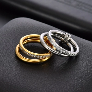 18K gold and silver triple interlocking bands with pavé crystals on black leather