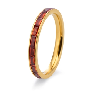 Macro detail of 18K gold-plated band ring with emerald-cut red crystal stones