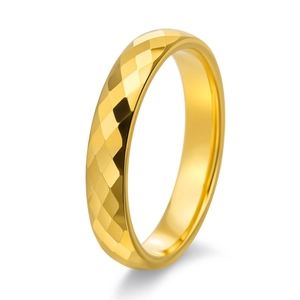 Detailed view of the diamond-cut geometric faceted gold tungsten steel ring band