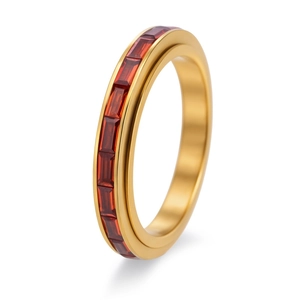 Detail of eternity ring in 18K gold finish with channel-set rectangular red zircons