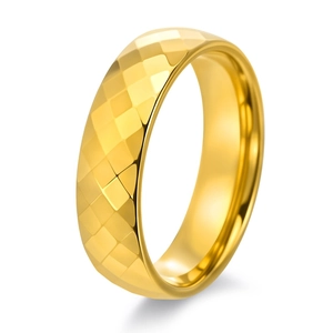 Polished gold tungsten ring with geometric quilted facets and reflective finish