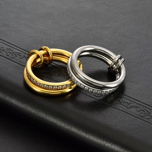 Polished 18K gold and silver stacked titanium rings with sparkling pavé crystals