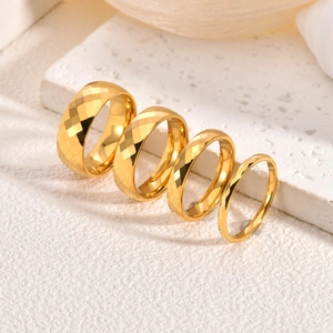 Polished gold tungsten rings with geometric diamond-cut patterns in four widths