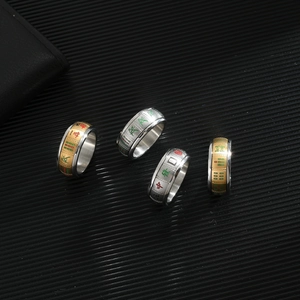 Rotating stainless steel mahjong rings featuring classic Chinese character patterns