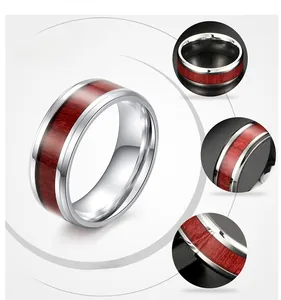 Detail display of titanium steel ring with wood inlay and polished silver inner band