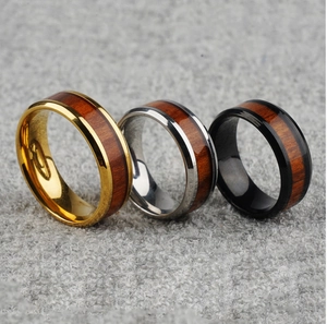 Men's stainless steel rings in gold, silver, and black with natural wood grain inlay