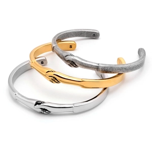 Three-color titanium steel open bracelets in gold, silver, and vintage finish with knot texture