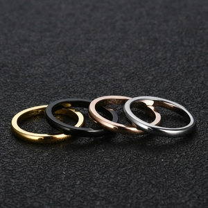 Set of four minimalist 2mm stainless steel rings in gold, black, rose gold and silver