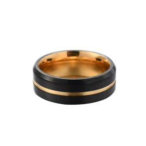 Detail of matte black men's ring with gold inner band and polished gold groove accent