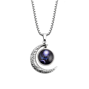 Detailed view of silver moon pendant with blue nebula galaxy glass and box chain