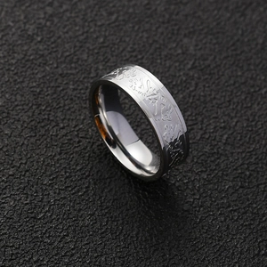 Men's titanium steel ring with silver dragon relief engraving in a 45-degree angle view