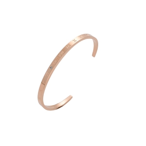 Minimalist C-shaped rose gold open bangle featuring Roman numerals and a center crystal
