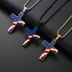 Three stainless steel American flag cross necklaces in gold, silver, and black on leather