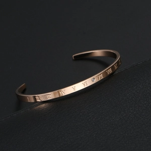 Elegant rose gold C-shaped cuff bangle with Roman numerals and a single zircon stone