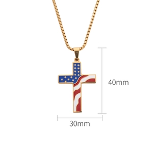Macro shot of 40mm golden cross pendant with American flag pattern on a box chain