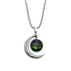 Luminous Zodiac moon necklace with engraved crescent pendant and glowing nebula sphere