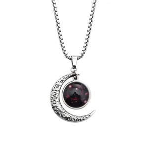 Detailed view of luminous zodiac necklace with vintage crescent moon and star pattern