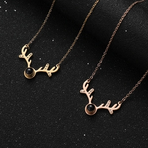 Collier bois de cerf or rose avec pierre de projection Je t'aime en 100 langues
