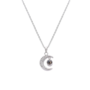 Silver crescent moon necklace with hidden 100 languages I love you projection stone