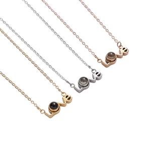 Love projection necklace in gold, silver, and rose gold with 100 languages stone