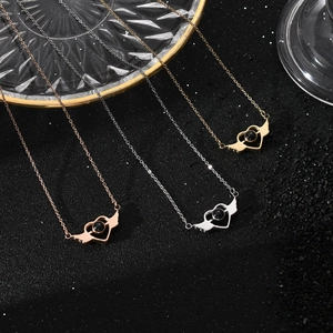 Angel wing heart necklaces in rose gold, silver, and gold with projection stone