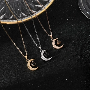 Star and crescent moon projection necklace in gold, silver and rose gold finishes