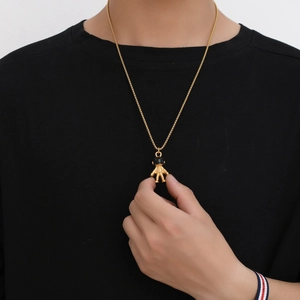 Harajuku hip hop astronaut pendant necklace in gold finish worn on black t-shirt