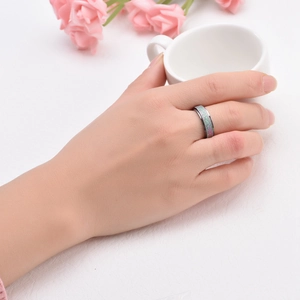 Titanium frosted spinning ring for couples with colorful sand finish on hand