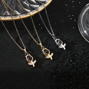 Macro detail of rose-shaped projection pendant featuring inlaid zircon and center stone