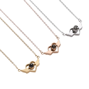 Angel wing heart projection necklace in gold, rose gold, and silver finishes