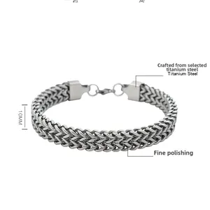 Detail of 10mm double-row titanium steel wheat chain bracelet with polished silver finish