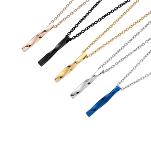 Detailed view of polished twisted bar necklaces in five distinct metallic colors