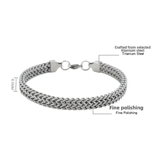 Macro shot of 6.5mm polished titanium steel woven chain bracelet showing fine details