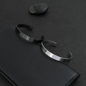 Minimalist stainless steel open C-shape cuff bracelet in matte black and polished silver