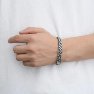 Detail of silver double-layered wheat chain bracelet for men with retro punk texture