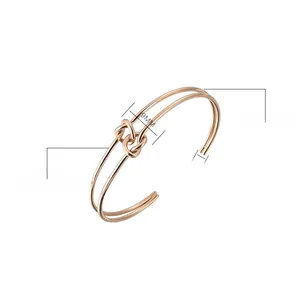 Detail of rose gold stainless steel knot cuff bangle showing 9mm and 6mm dimensions