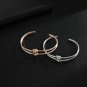 Minimalist knot open cuff bracelet for women in rose gold and polished silver steel