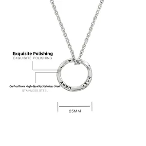 Detailed view of 25mm Mobius pendant in polished steel with fine surface engraving