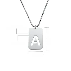 Detailed view of silver stainless steel dog tag necklace with cutout letter A and box chain