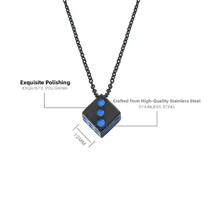 Polished titanium steel dice pendant with blue dots on black surface, 12mm size