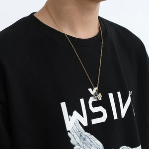 Titanium steel hip-hop necklace with a gold cube dice pendant and blue dot details