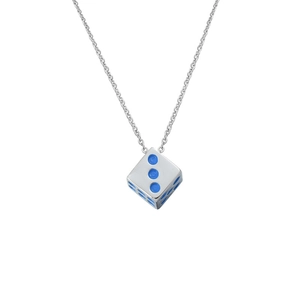 Macro shot of titanium steel dice pendant with blue enamel dots and polished silver chain