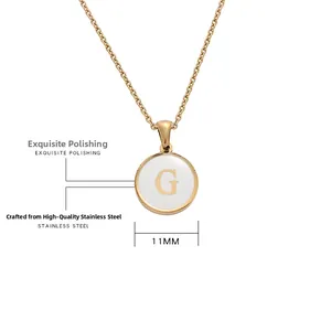 Detailed macro view of 11mm stainless steel gold disc pendant with engraved letter G