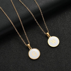 Gold stainless steel initial necklaces with round white enamel G and W pendants