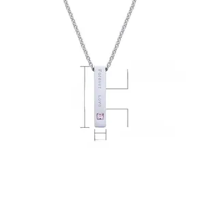 Detail view of 31.5mm steel bar pendant with Forever Love engraving and pink gemstone