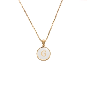 Detailed macro view of a gold chain necklace with round white enamel pendant featuring letter G