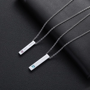 Matching silver couple necklaces with Forever Love engraving and cubic zirconia pendants